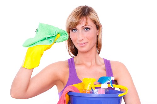 Carpet cleaning technician preparing equipment in a safe residential setting